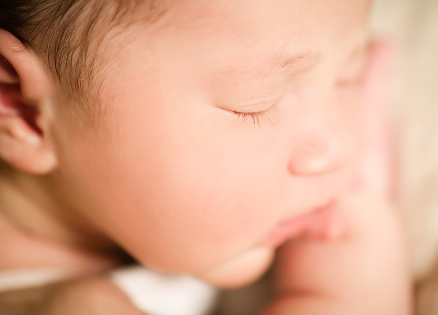 Closeup image of a newborn baby at an in-home newborn session in Chandler, Arizona
