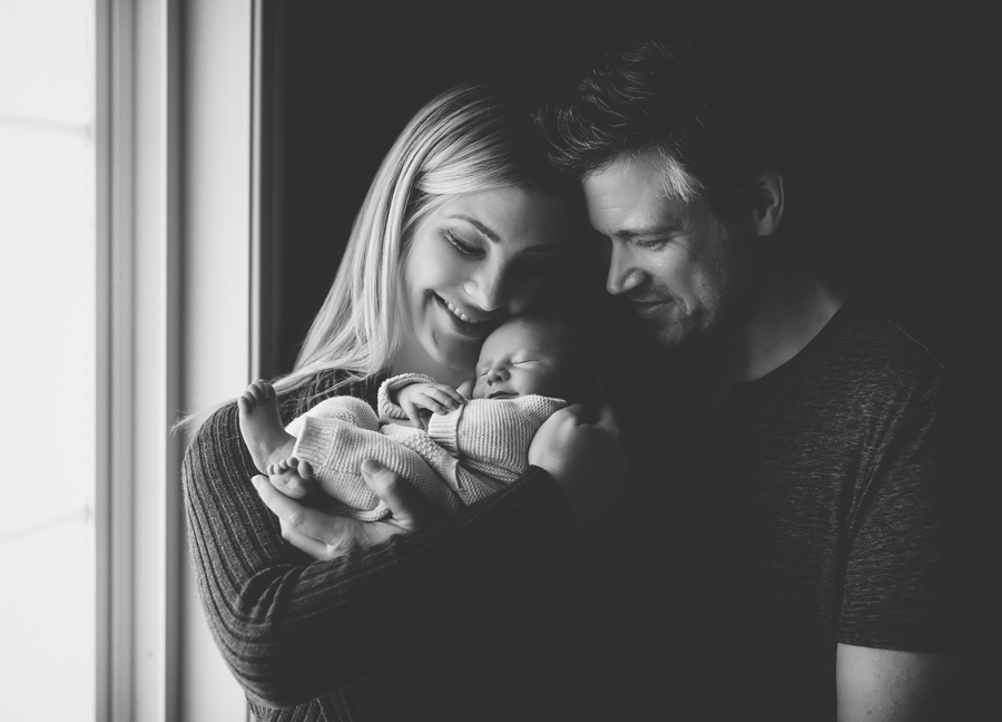 Chandler Arizona baby photographer: parents holding their newborn baby