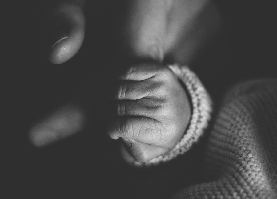 Chandler Arizona baby photography: father holding his baby's hands