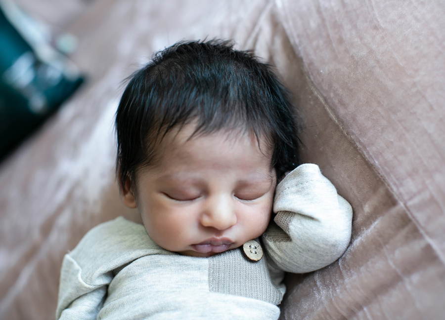 A posed newborn baby at an in home newborn session in Northern Virginia.