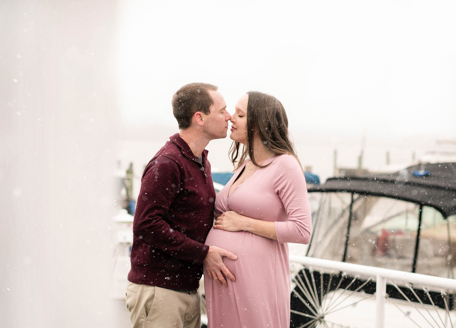 A couple kissing during a Old Town Alexandria Maternity Photoshoot