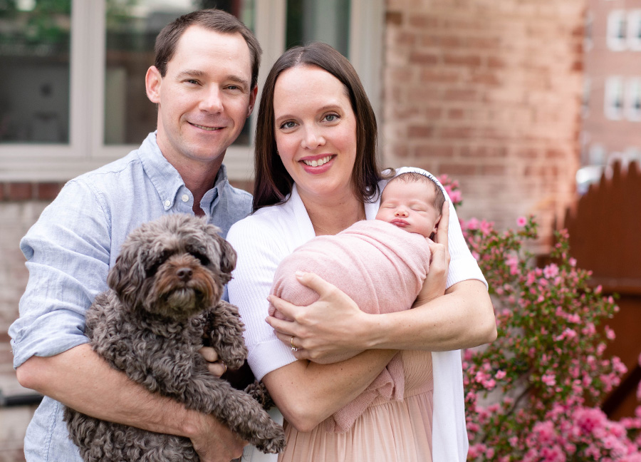 outdoor newborn photoshoot with Mom, Dad, dog, and a newborn baby