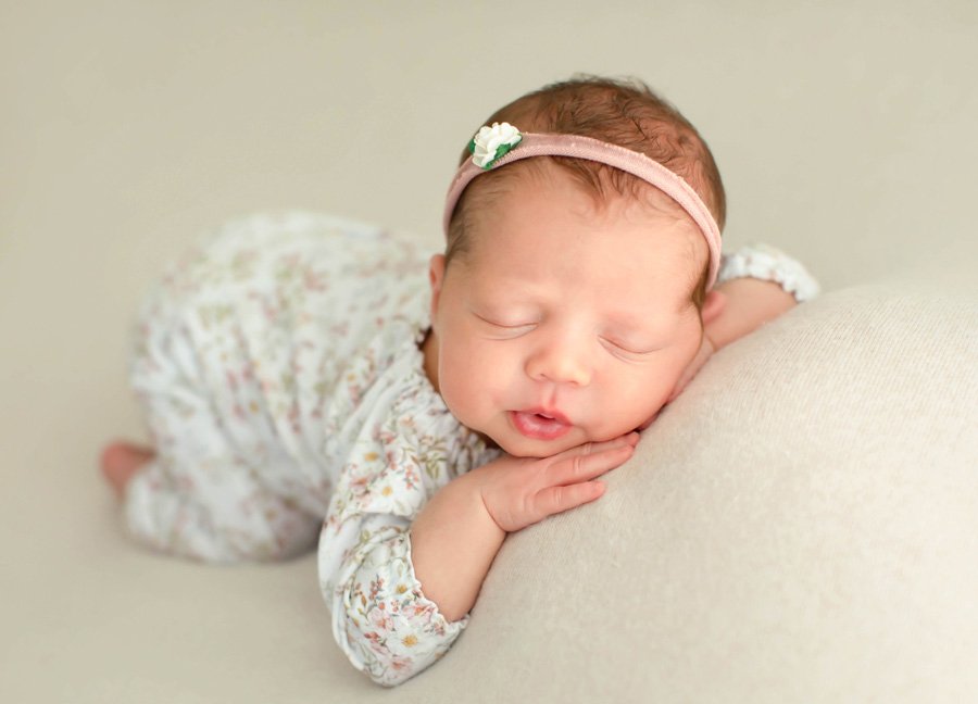 in home vs in studio newborn photography featuring a baby in a studio