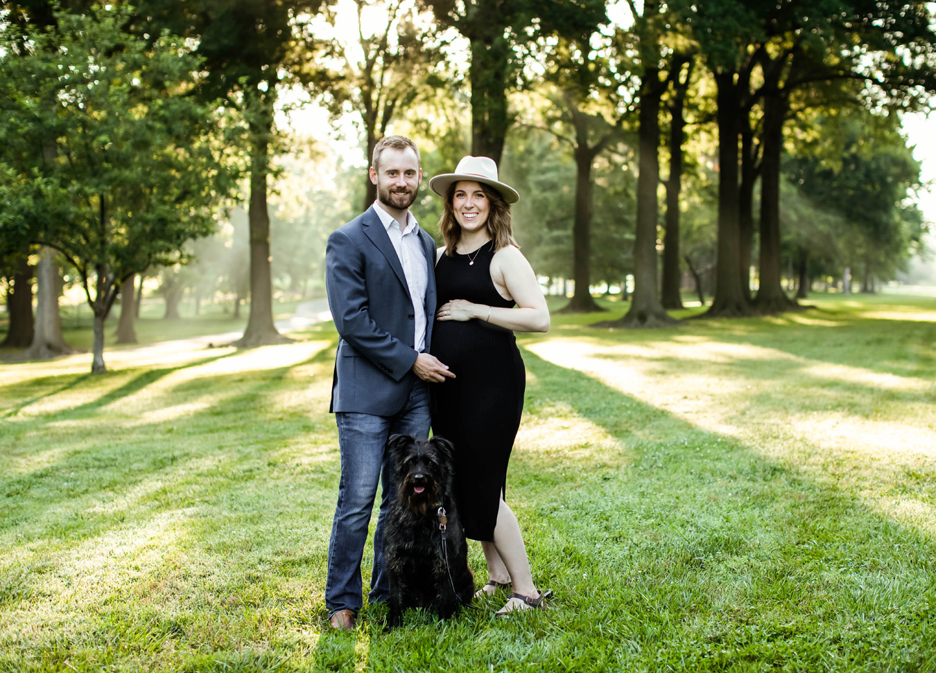 northern Virginia maternity session in a park featuring a husband, wife, and dog