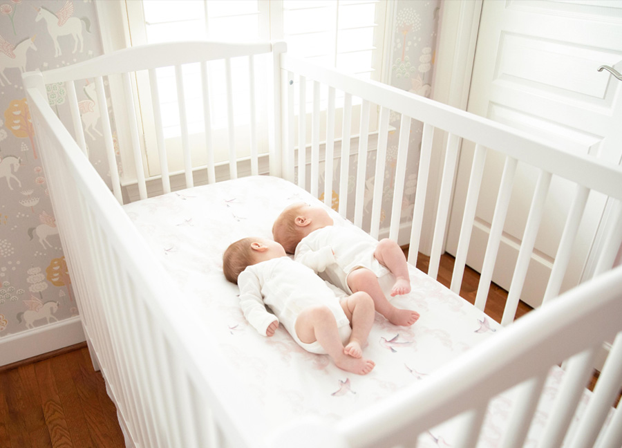 newborn twins laying next to each other captured by a northern Virginia newborn photographer