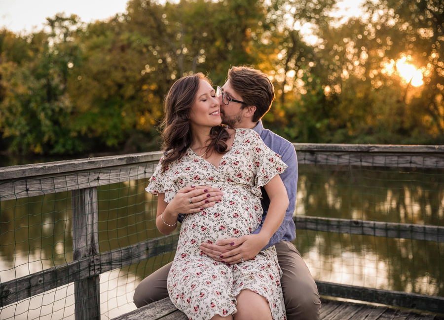 Maternity Photo Session In D.C. featuring a couple sitting in a park