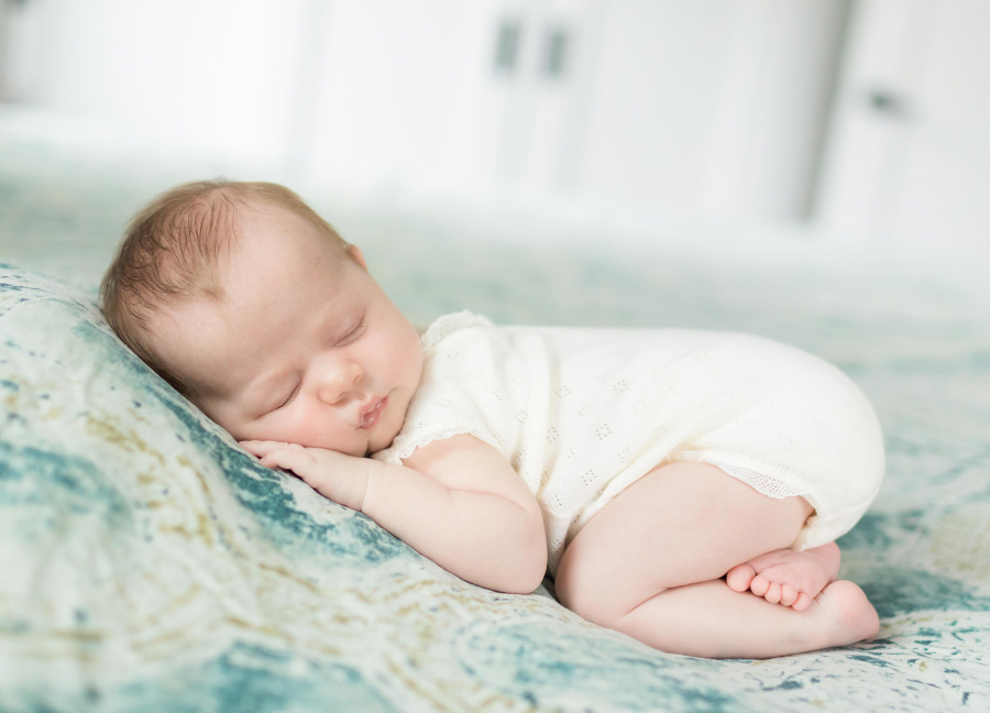 Posed newborn baby during their in-home newborn session in Washington, DC.