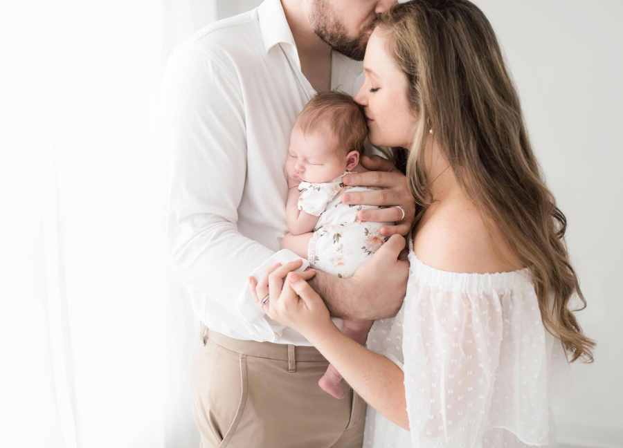 Beautiful family portrait with a newborn baby during their studio newborn session in Loudoun County. 