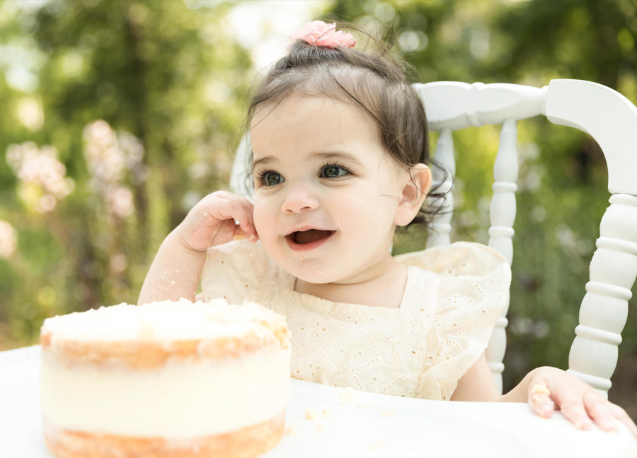 little girl smiling during her first birthday milestone portraits