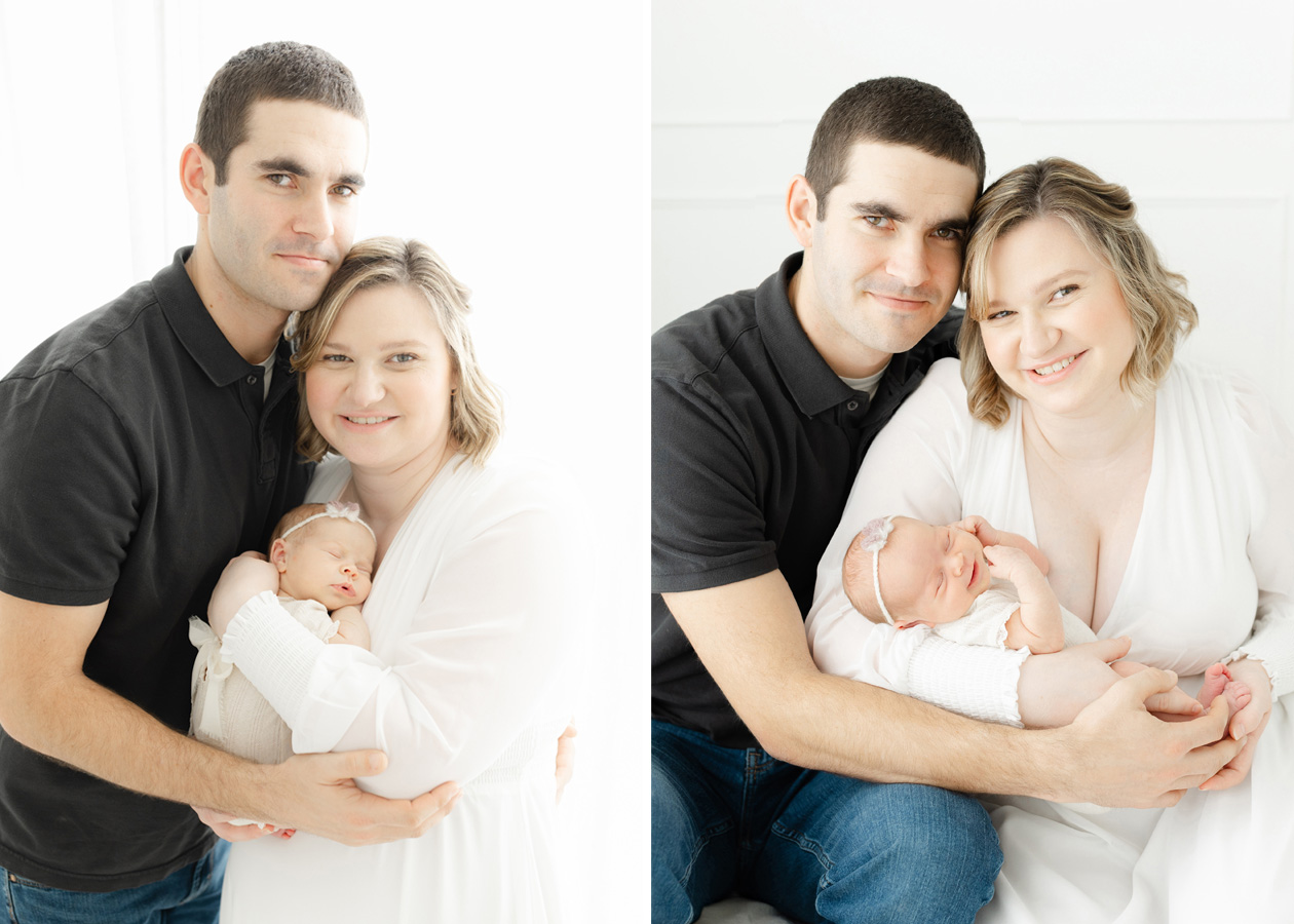New parents holding their newborn baby during a light-filled studio family portrait session, capturing a timeless and emotional newborn photography moment