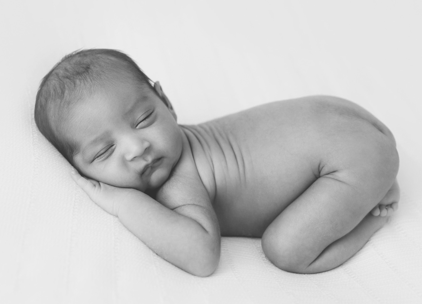 newborn photo of a naked baby