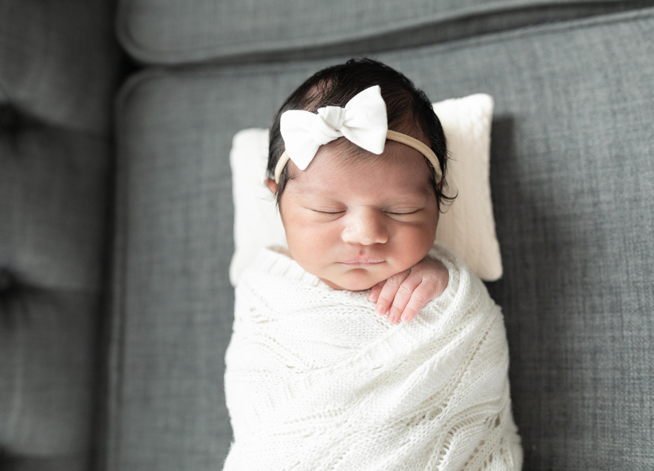 a newborn baby all bundled up and photographed by a newborn photographer in D.C.