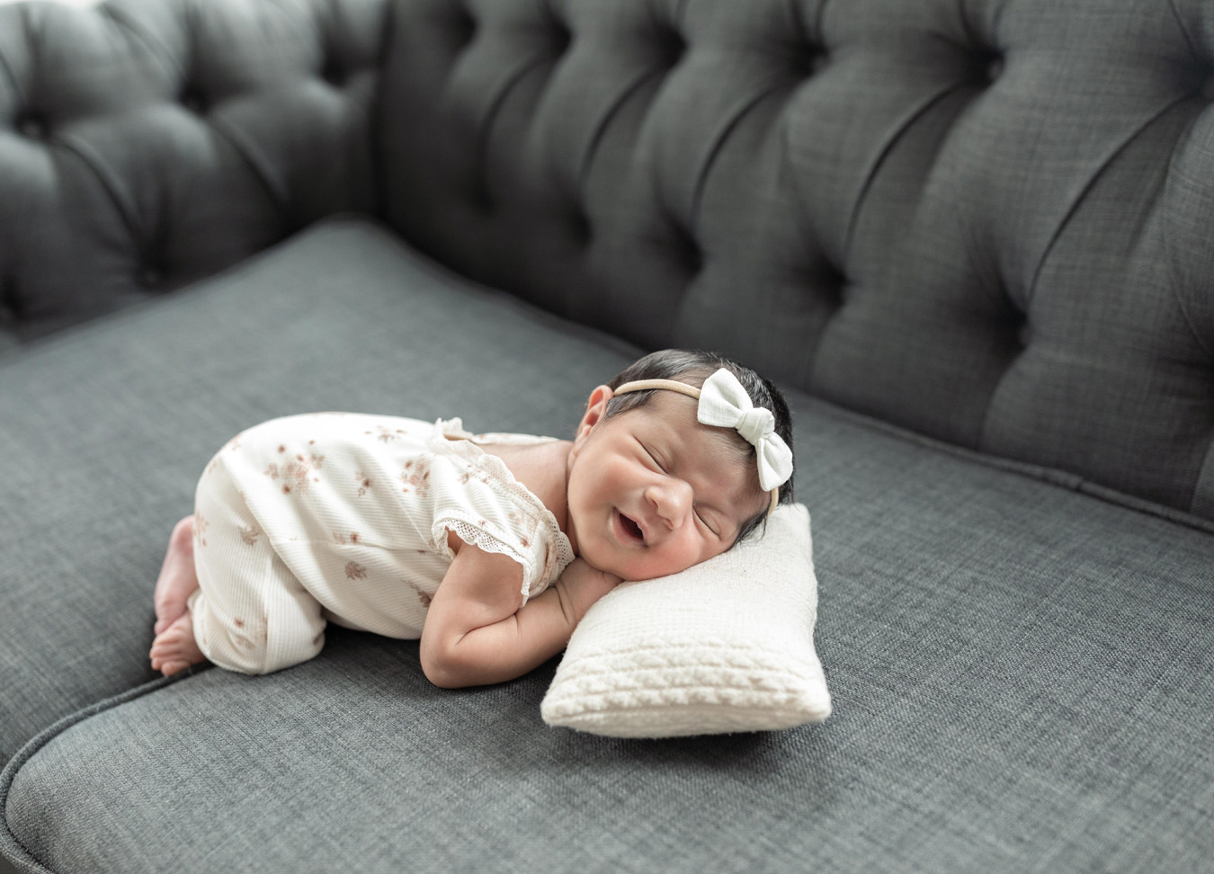 a sweet newborn smile photographed by a newborn photographer in D.C.