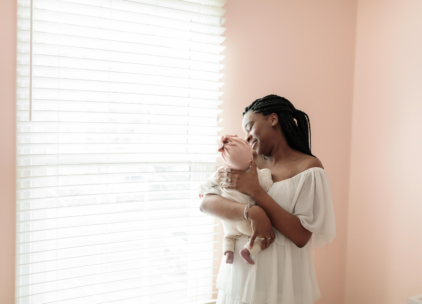 northern virginia newborn photographre captures a mom smiling at her newborn baby girl