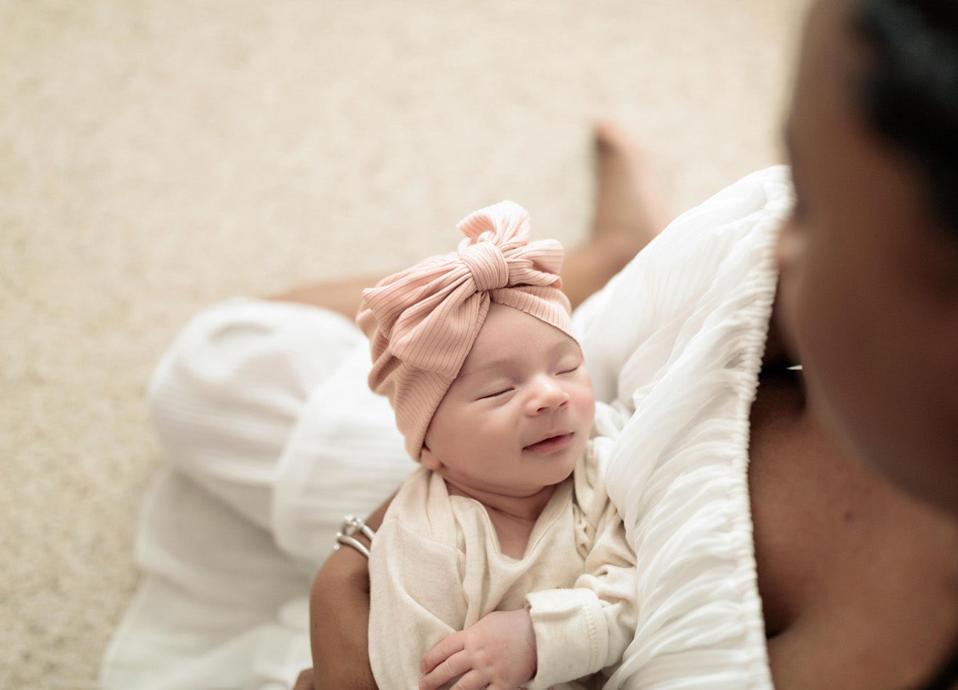 newborn smiling at her mother, captured by a newborn photographer in Northern Virginia 