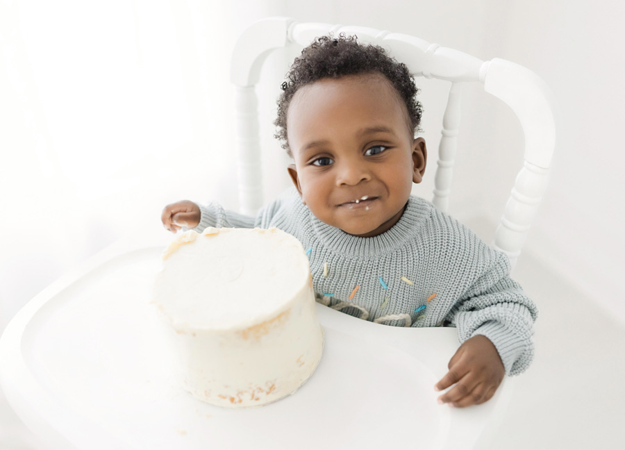 Little boy eating his smash cake