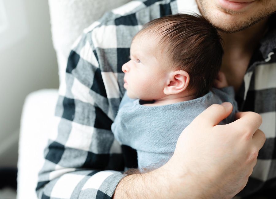 newborn baby laying on dads chest during a Newborn Shoot in Washington D.C. 