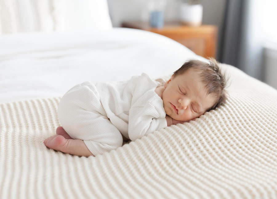 baby boy sleeping on a blanket captured by a Washington D.C. newborn photographer