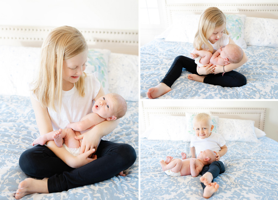 siblings holding their newborn sibling captured by a newborn photographer in Northern Virginia
