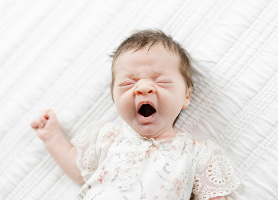 big yawn of a newborn baby girl captured by a washington dc newborn photographer