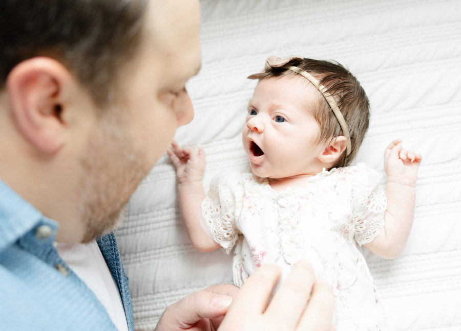 midwives in Washington DC featuring a dad and his newborn baby girl