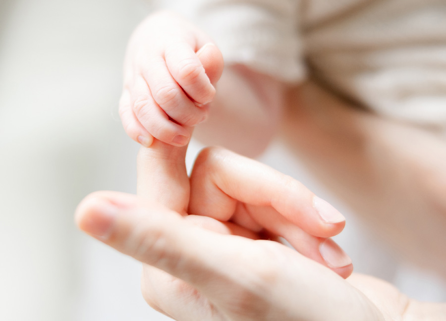 little hands grabbing their mamas hands