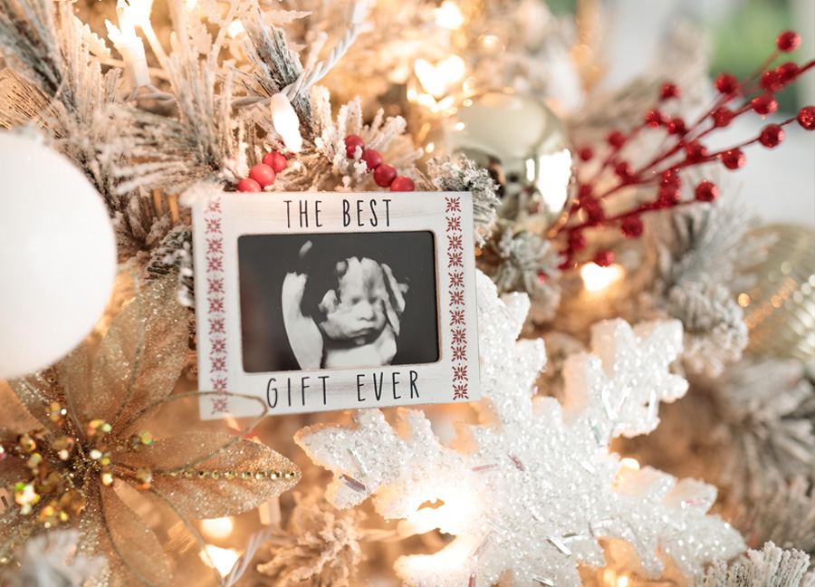 an ornament with an ultrasound image in a Christmas tree