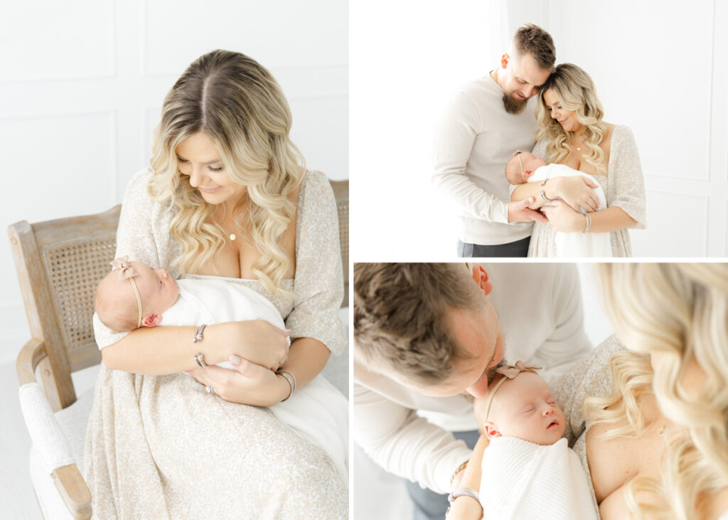 Newborn studio session with parents holding their newborn baby girl wrapped in a white swaddle blanket