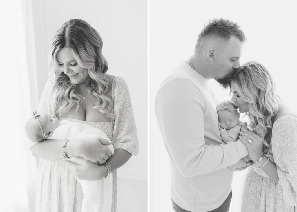 Black and white image of a man and woman holding a newborn baby girl