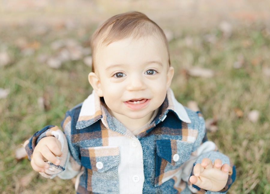 sweet boy smiling during a photoshoot captured by a family photographer in northern virgnia