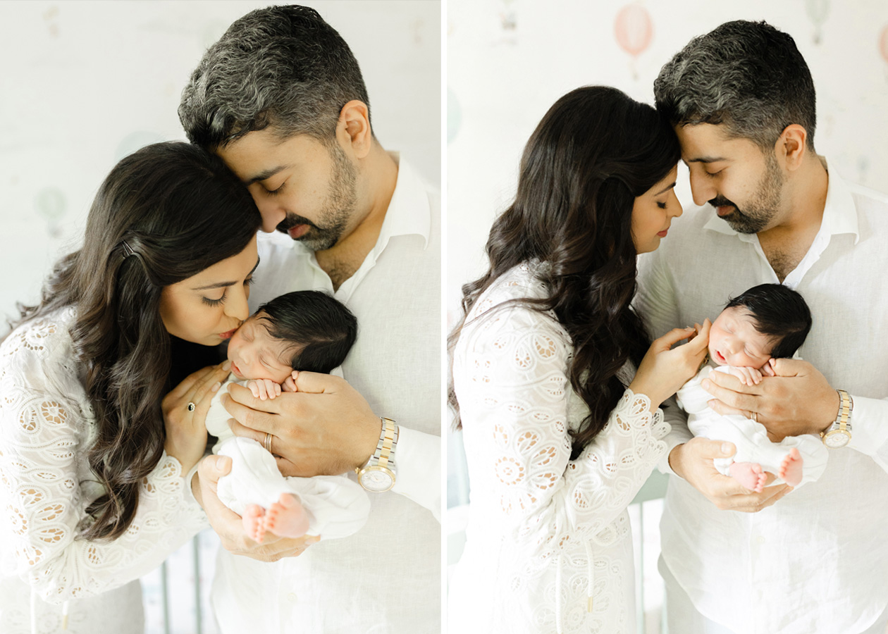 Loving parents dressed in neutral outfits bonding with their newborn in a soft, neutral-toned nursery during a cozy in-home session.
