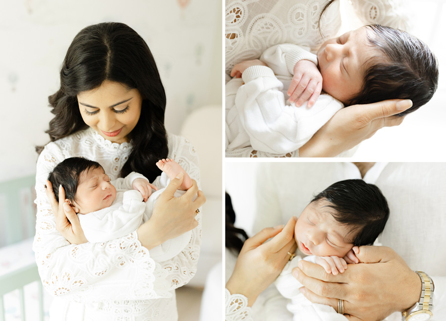 A new mother dressed in a white lace dress bonding with her newborn in a soft, neutral-toned nursery during a cozy in-home session.