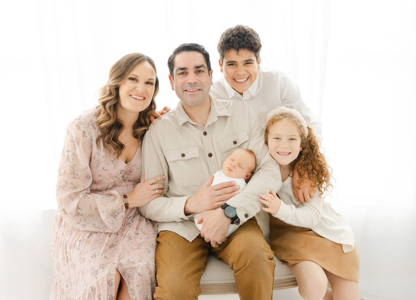 Trendy family photography outfit ideas featuring family photoshoot in studio