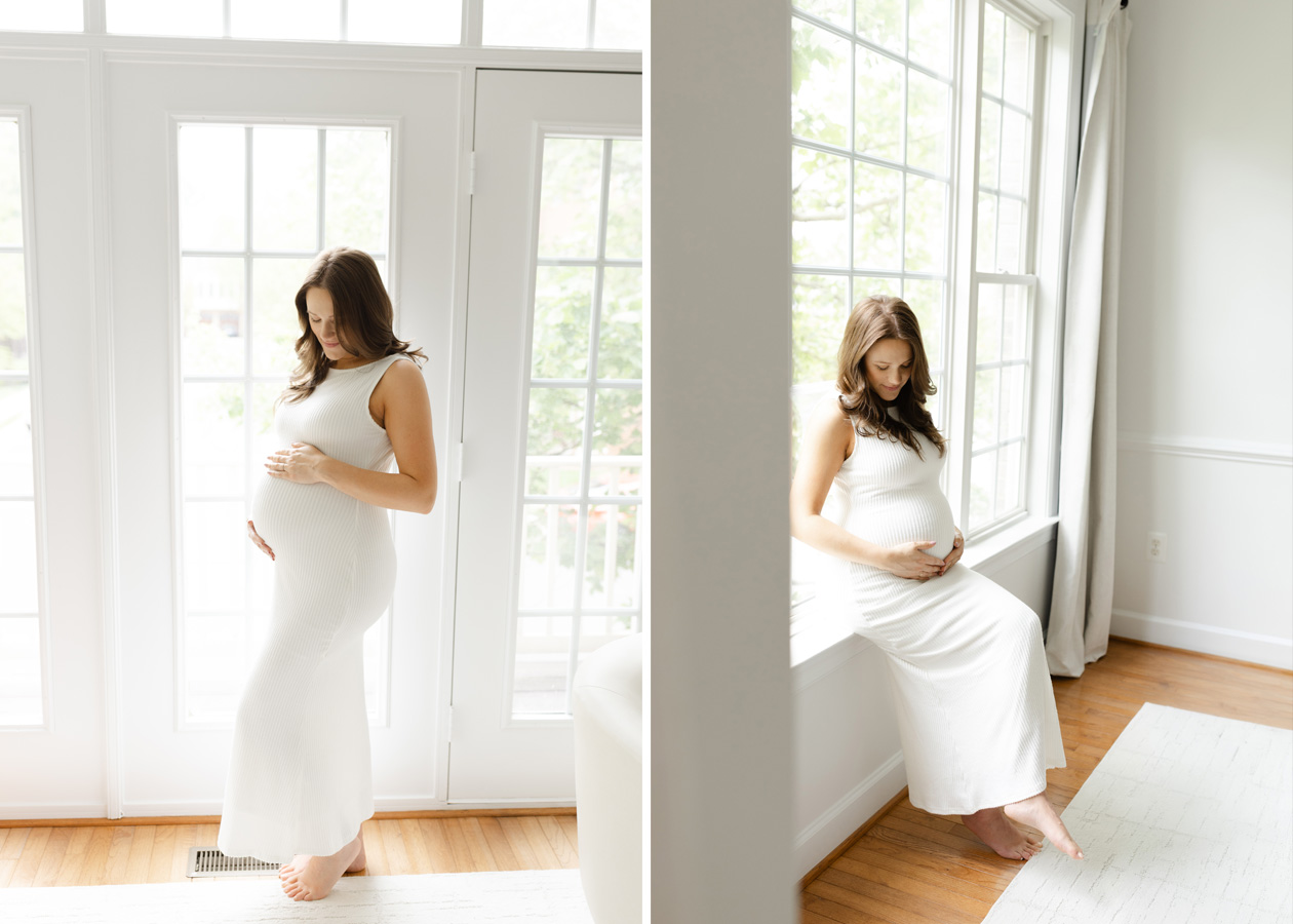 Elevated maternity photography in Northern Virginia featuring mom to be in white dress standing next to a wall of windows.