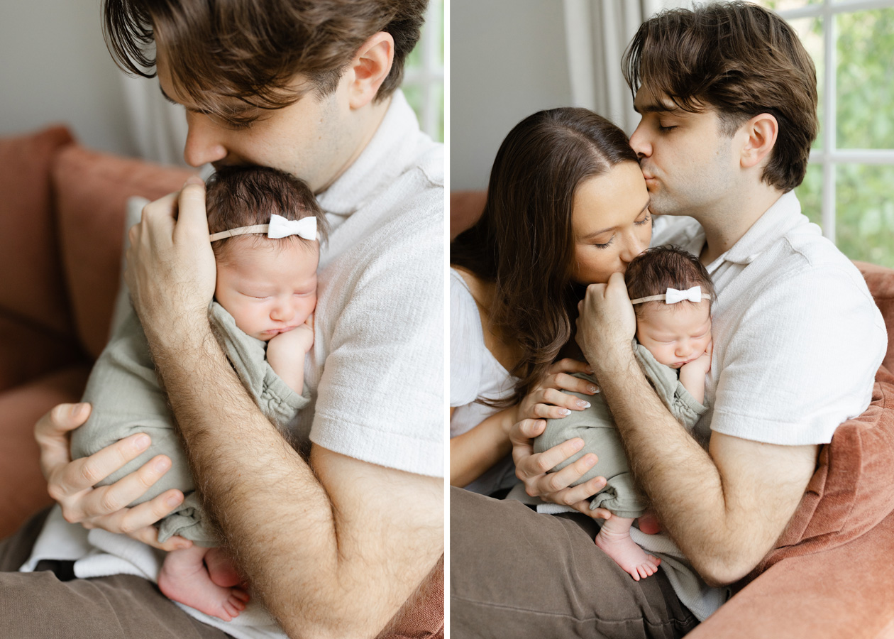 In-home newborn photography in Northern Virginia capturing a mother and father cuddling and kissing their sleeping baby girl while relaxing together on the sofa.